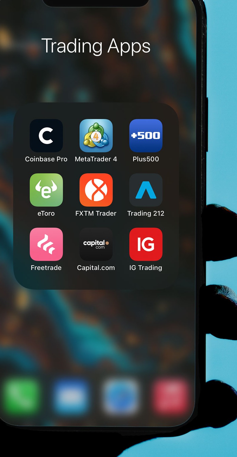 Trading applications displayed on a smartphone home screen