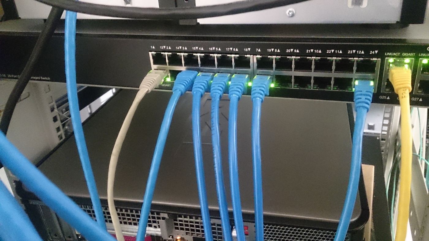 Network cables connected to an Ethernet switch in a server rack